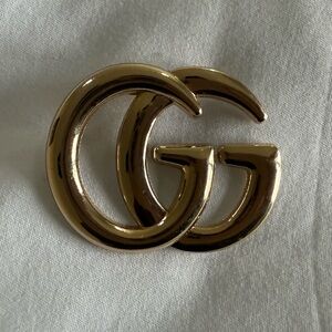 Gold GG brooch
